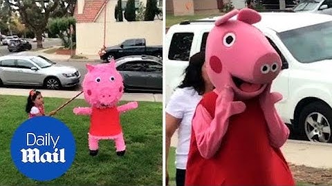 Hilarious moment little year girl furiously hits Peppa Pig piñata
