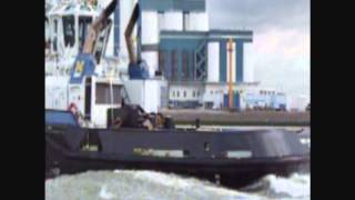 Tugboat Smit passing by at full speed. Rotterdam, Holland Tugboat Smit passing by at full speed. Rotterdam, Holland