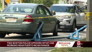 Police officers hit by car near parade route