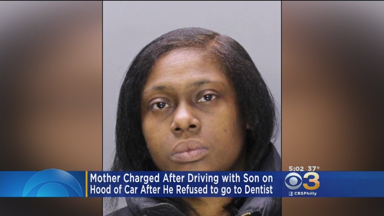 Mother Charged After Driving With Son On Hood Of Car - YouTube