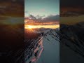 Golden Peaks: Focuses on the reflection of sunset light on the snow.