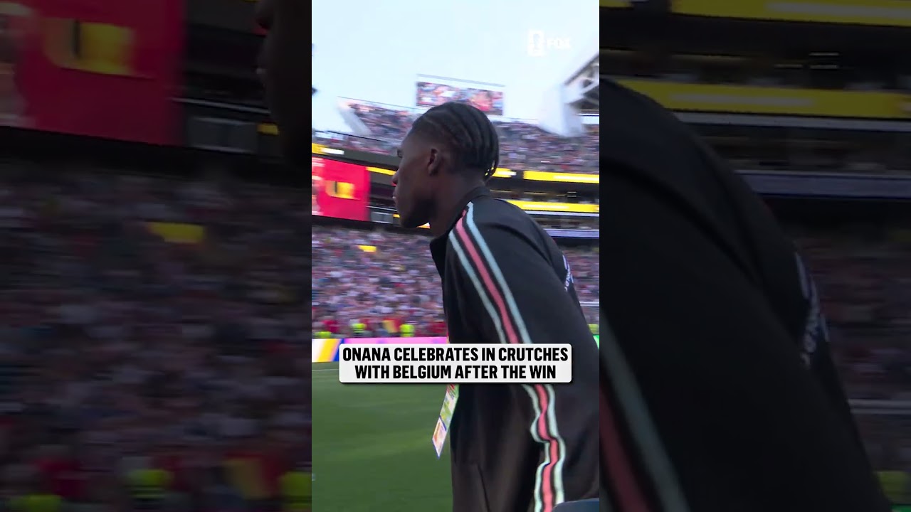 Belgium's Amadou Onana celebrates with his team after suffering from an injury earlier in the match