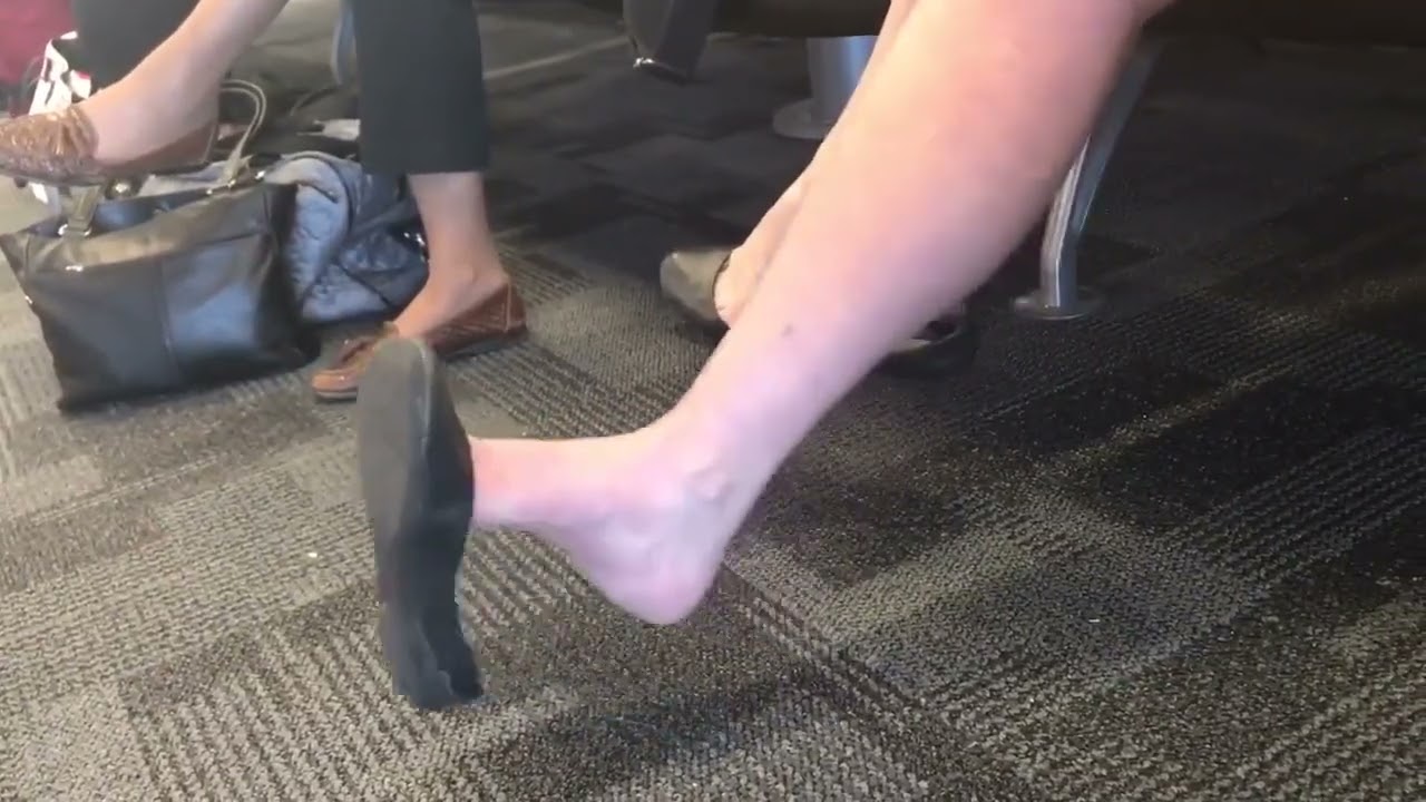 Candid Woman Anxiety Struggling shoeplay dangling in black flats - more on website