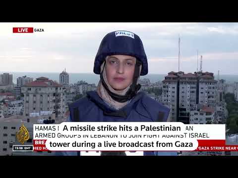 Reporter's live broadcast from Gaza interrupted as missile hits tower