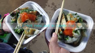 Eating chive pancake in Cambodia