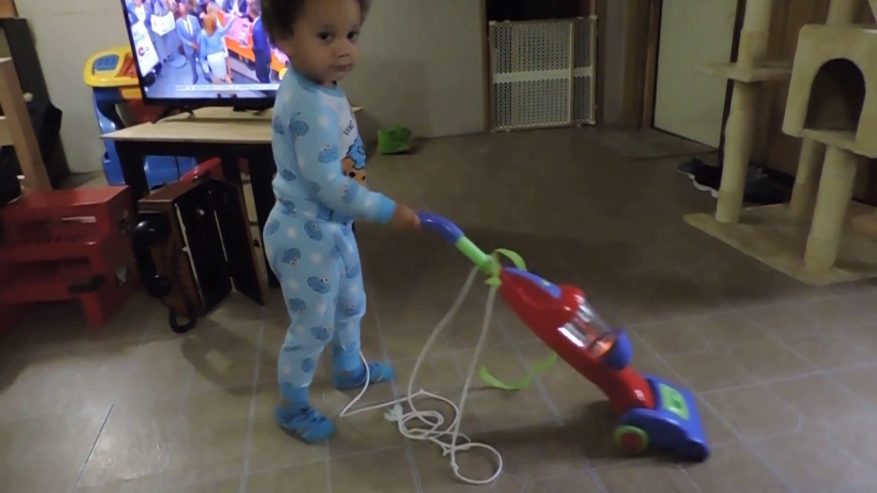 Lloyd Vacuuming with Toy Vacuum