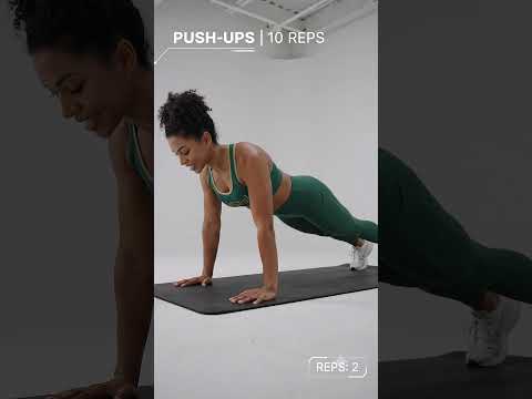 Trainer performing push ups