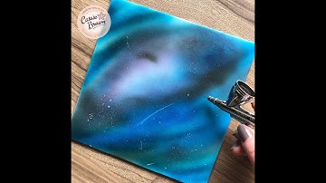 Airbrushing a galaxy scene on sugarpaste/fondant