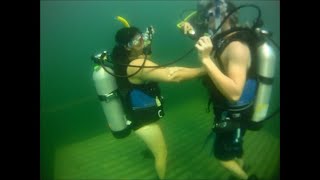 Woman Learns To Scuba Dive In Lake With Other Divers
