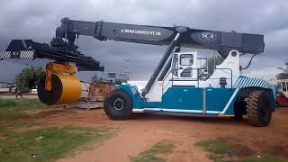 SCA heavy equipment reach stacker with coil attachment