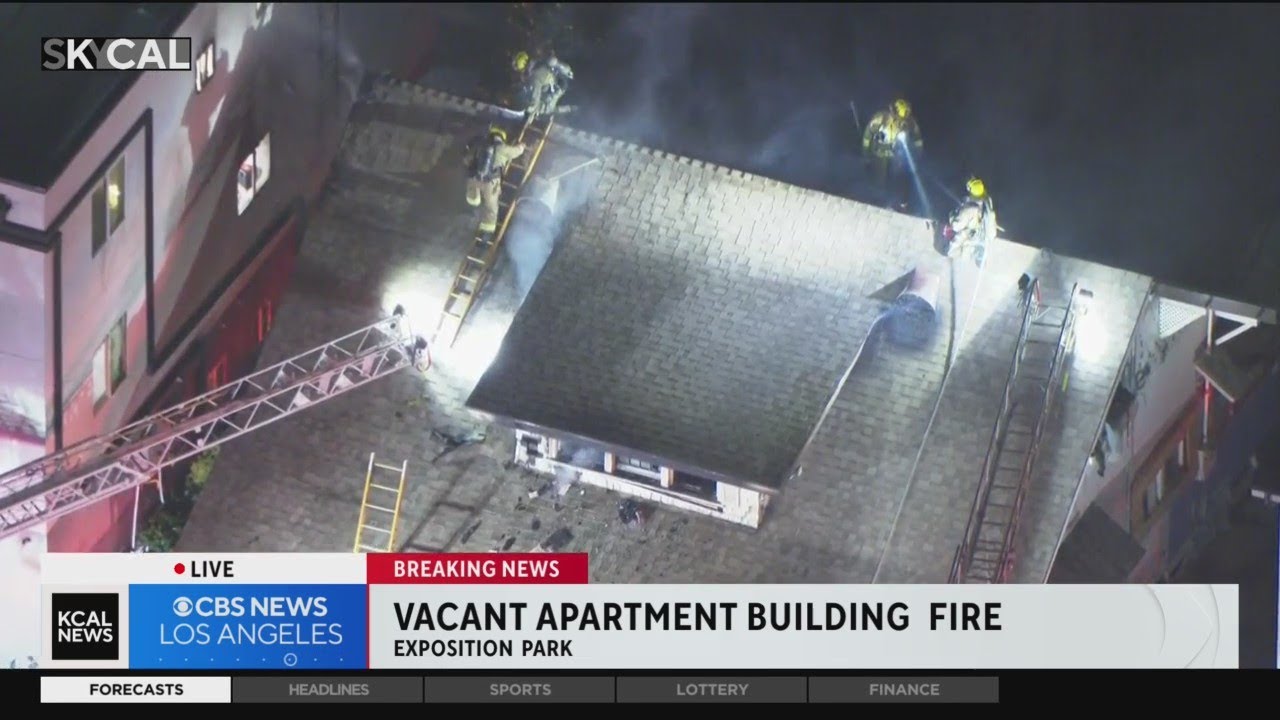 Fire erupts inside vacant apartment building in Exposition Park - YouTube
