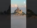 France’s iconic Mont Saint-Michel rises above the fog