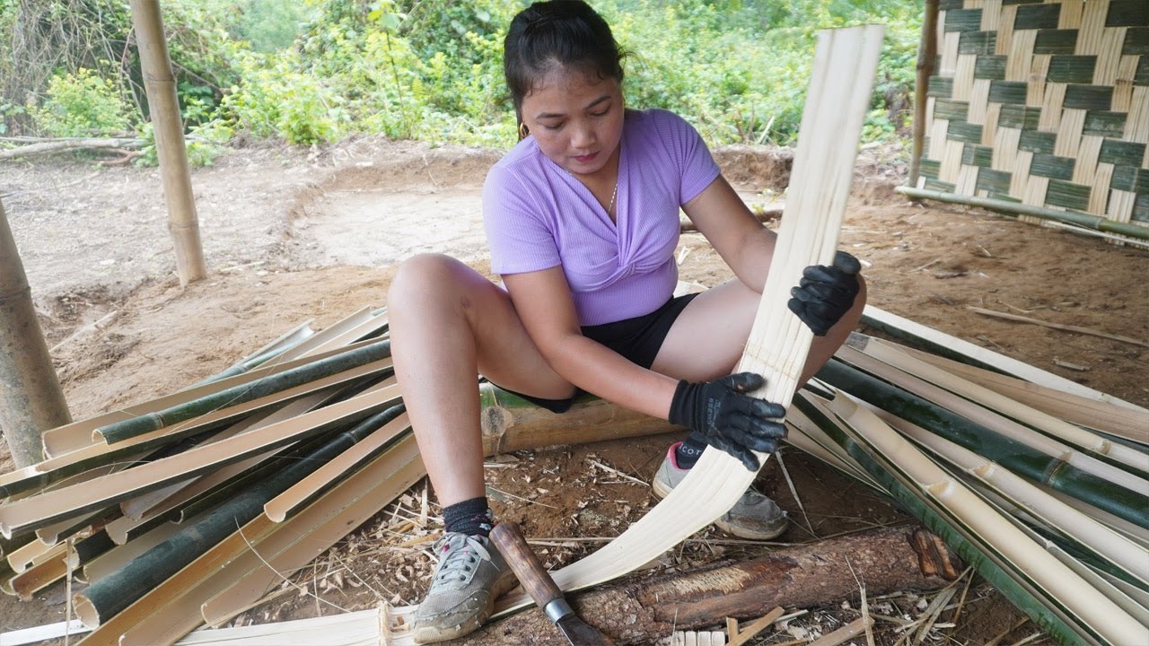 Young girl build bamboo house in the forest - Build bamboo wall for ...