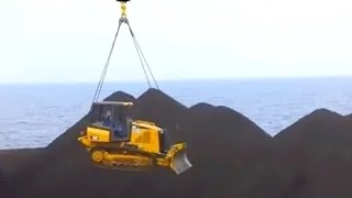 Extreme operation of CATERPILLAR D3K XL dozers. These tractors work on the open sea. Original sound.