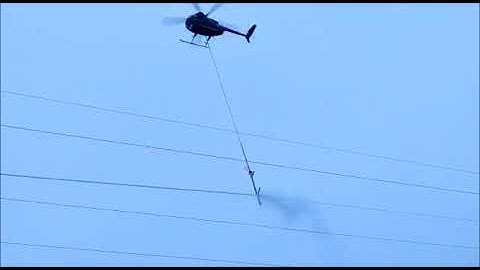 Ice removal from 110 kV power lines with helicopter