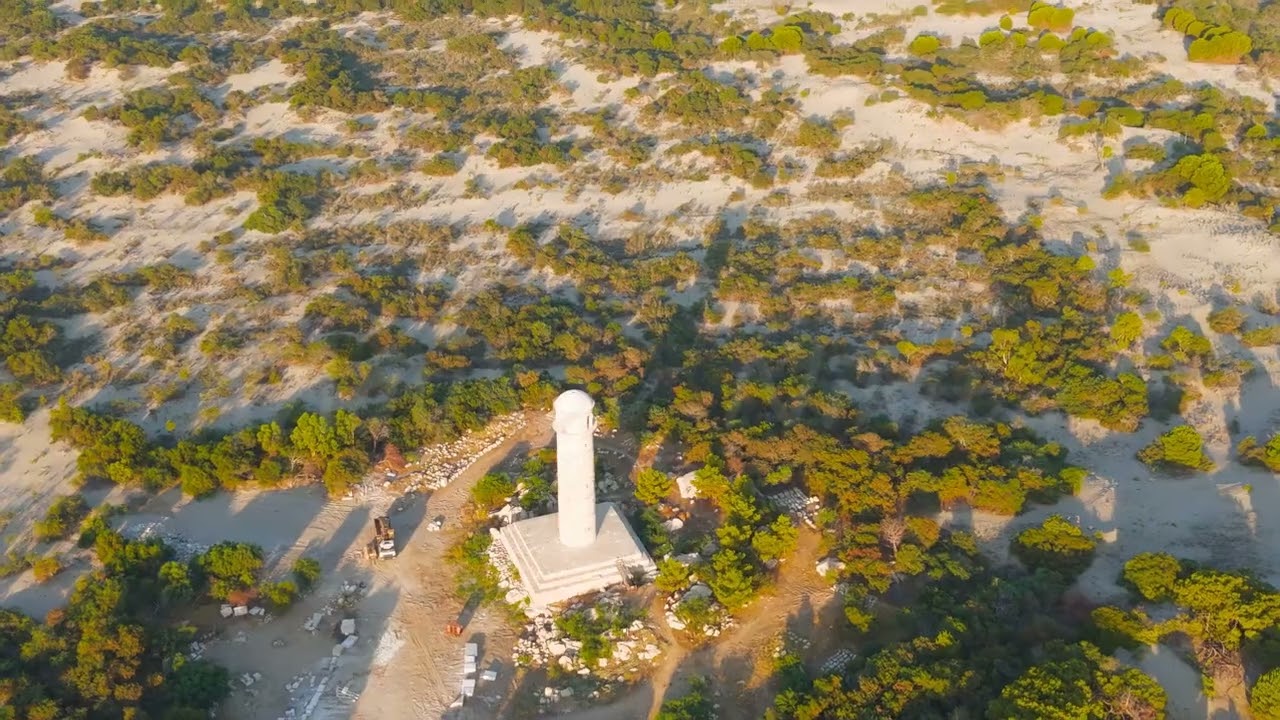 Gelemis, Turkey. Ancient Roman lighthouse overlooking Mediterranean Sea at Patara, morning waves ...