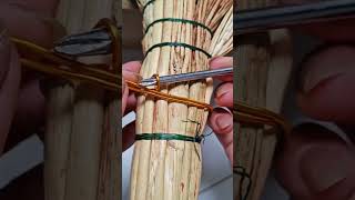 The Process Of Tying A Broom Using Wire So That It Is Strong And Doesnt Come Off Easily