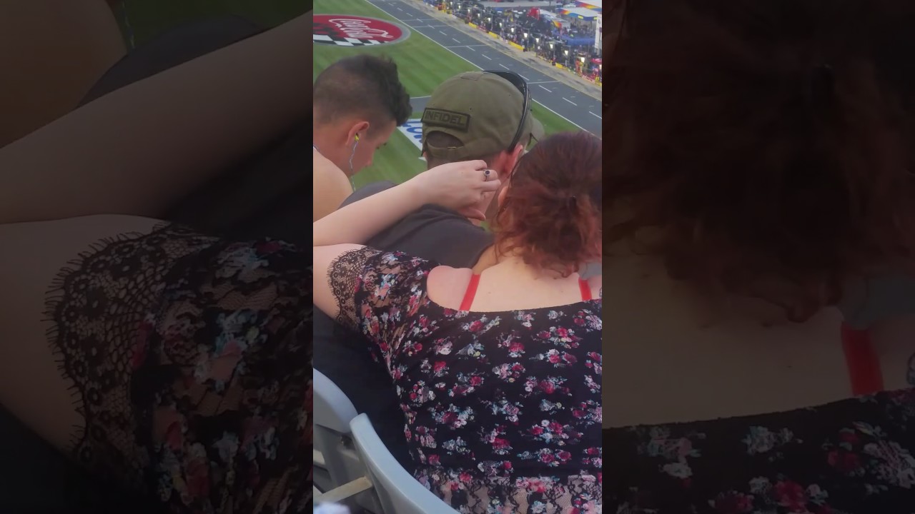 Girl pops boyfriends pimples during nascar race