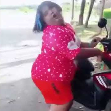 Girl reving motorbike and dancing
