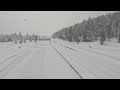 Snow falls on nearly deserted interstate in Truckee, California
