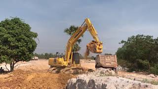 Komatsu PC210 And Dump Truck Working