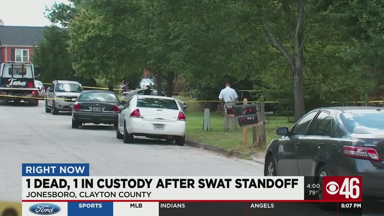 1 dead, 1 in custody after SWAT standoff - YouTube