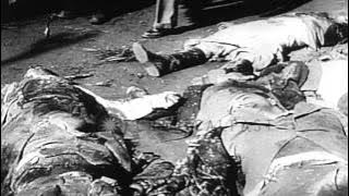 Angry mob views dead bodies of Benito Mussolini, his mistress and other Fascist l...HD Stock Footage