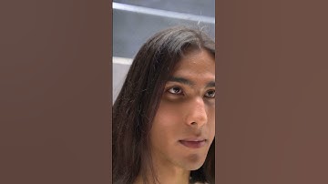 Thumbnail of video of a man with long hair posing in a rounded neck bella canvas t shirt 5814v