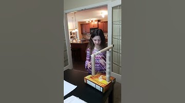 Hannah playing her home made harp