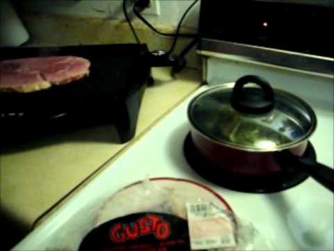 HAM STEAK W/BAKED POTATO AND STEAMED BRUSSELS SPROUTS