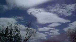 Alto stratus clouds passing through a standing wave - time lapse