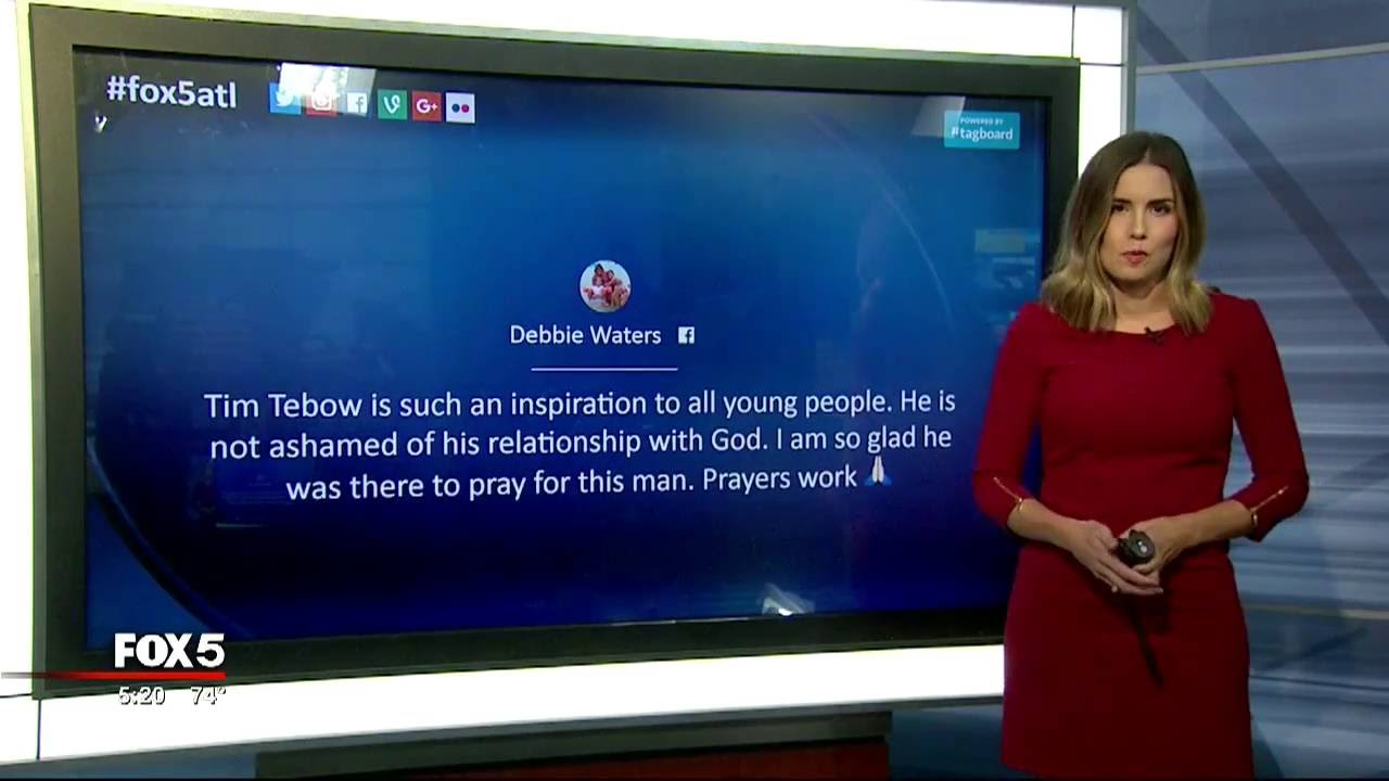 Tim Tebow prays over fan suffering from seizure after first baseball game