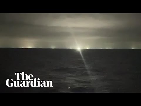 Chinese fleet vessels illuminate sea near Galápagos to attract squid to the surface