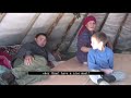 Hardship life of reindeer herders in russia baking bread in tundra