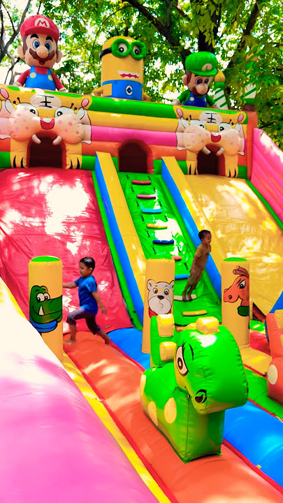 Jump and run around having fun on the balloon castle slide ride