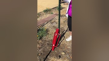 Removing a T-post with a post driver