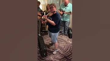 Thumbnail of Michael Cleveland jamming at the IBMA 2023