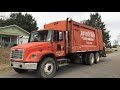 Orange Freightliner FL70 Heil Rear Loader Garbage Truck