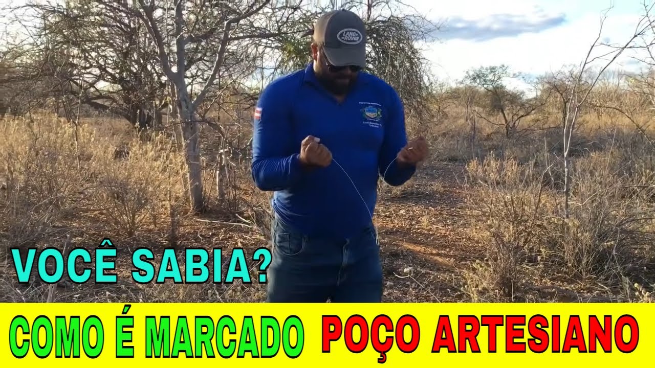 Marcando poço artesiano com gancho verde e varetas de cobre