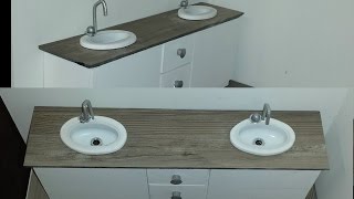 Double bathroom sink with two drawers that open.