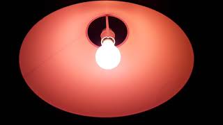 Crompton 60 watt red incandescent GLS light bulb in my old bedroom light screenshot 5