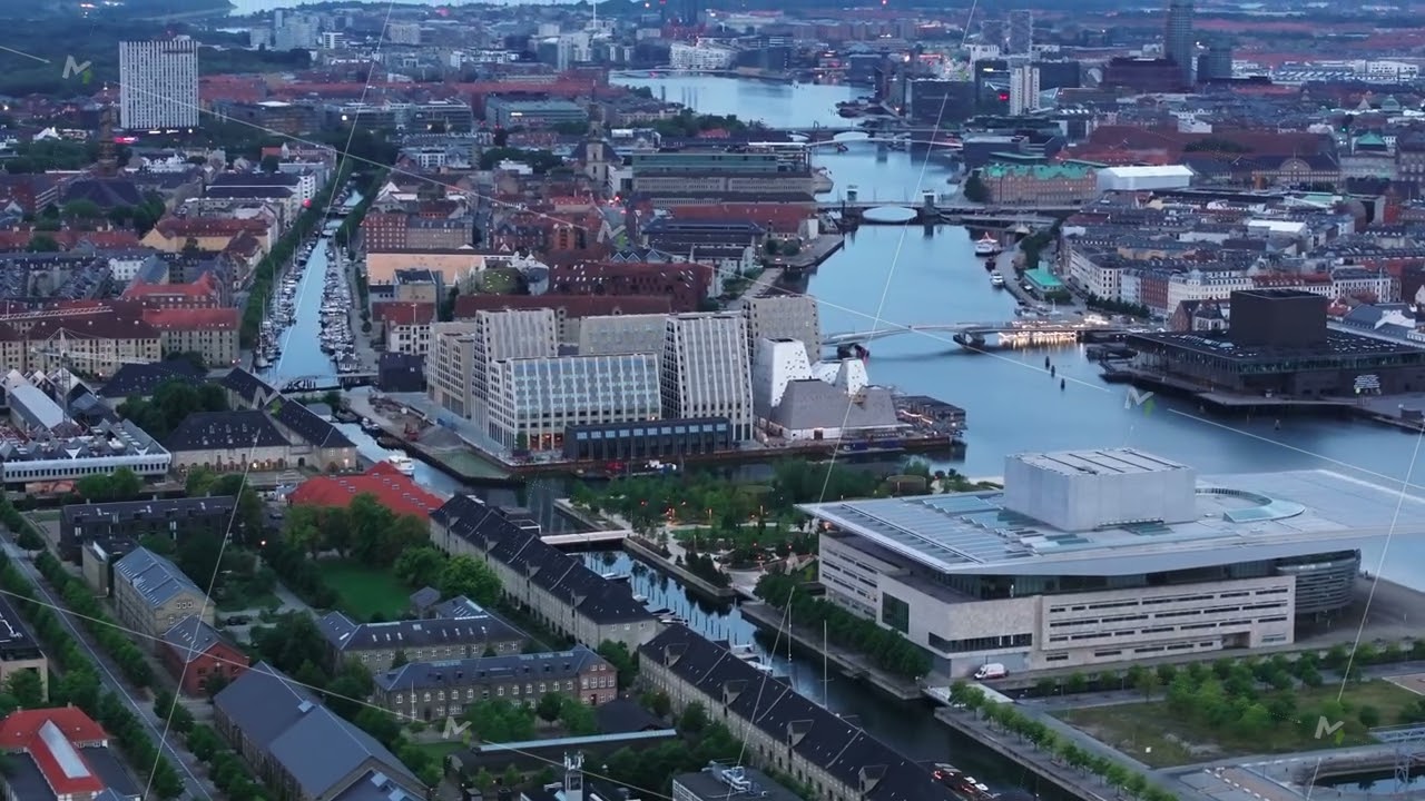 Aerial views capture Copenhagen, Denmark, showcasing charming canals and the iconic Royal Danish