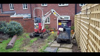 Micro Digger and Tracked Dumper removing a wall and digging out a garden Takeuchi TB210R