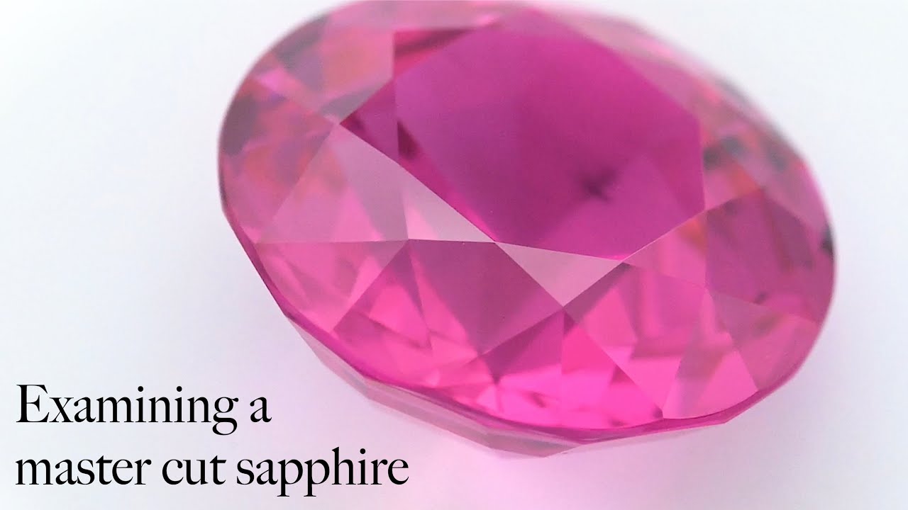 Examining a sapphire cut by old-world British Jambpeg Masters