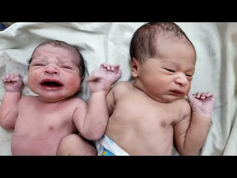 Cutest Twins newborn babies where one is already fed up of his sister