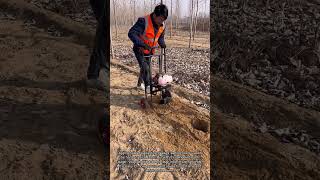 This wheeled earth auger makes digging holes so effortless! 😮 #farming #tools