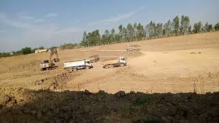 Excavator Cat Loading Dump Trucks 