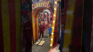 Boy walk through Halloween store and get scared from dead person decoration that jumped out at them