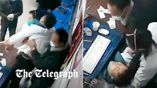 video: Watch: Doctor collapses from exhaustion as China buckles under ‘tsunami’ of Covid infections
