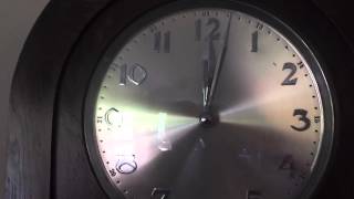 winding Sam's beautiful grandfather clock.